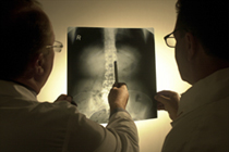 Doctors looking at X-rays